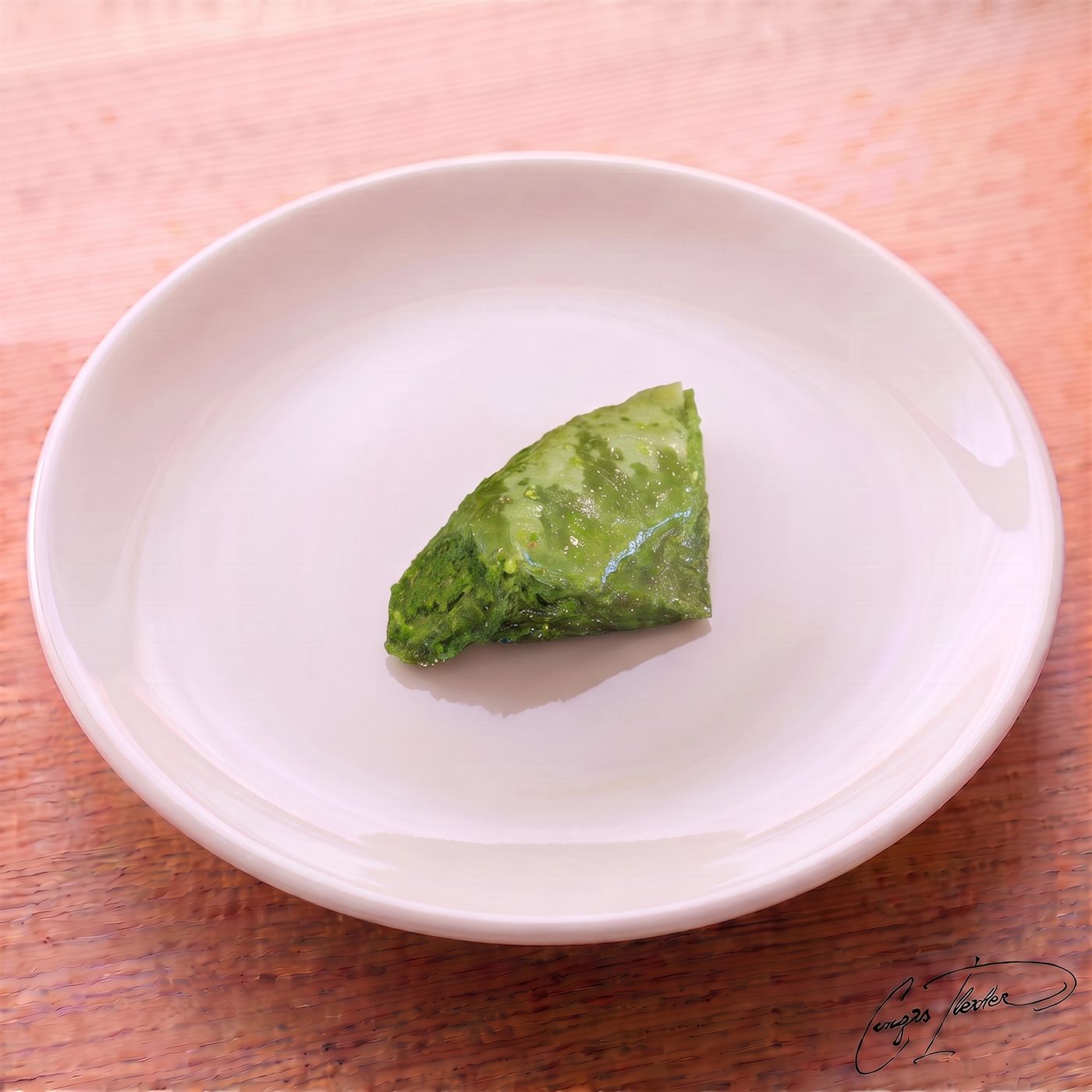 A single piece of yaprak şöbiyet — a bright green, triangular Turkish dessert made of folded phyllo dough generously filled with pistachio and soaked in syrup — resting on a white plate.