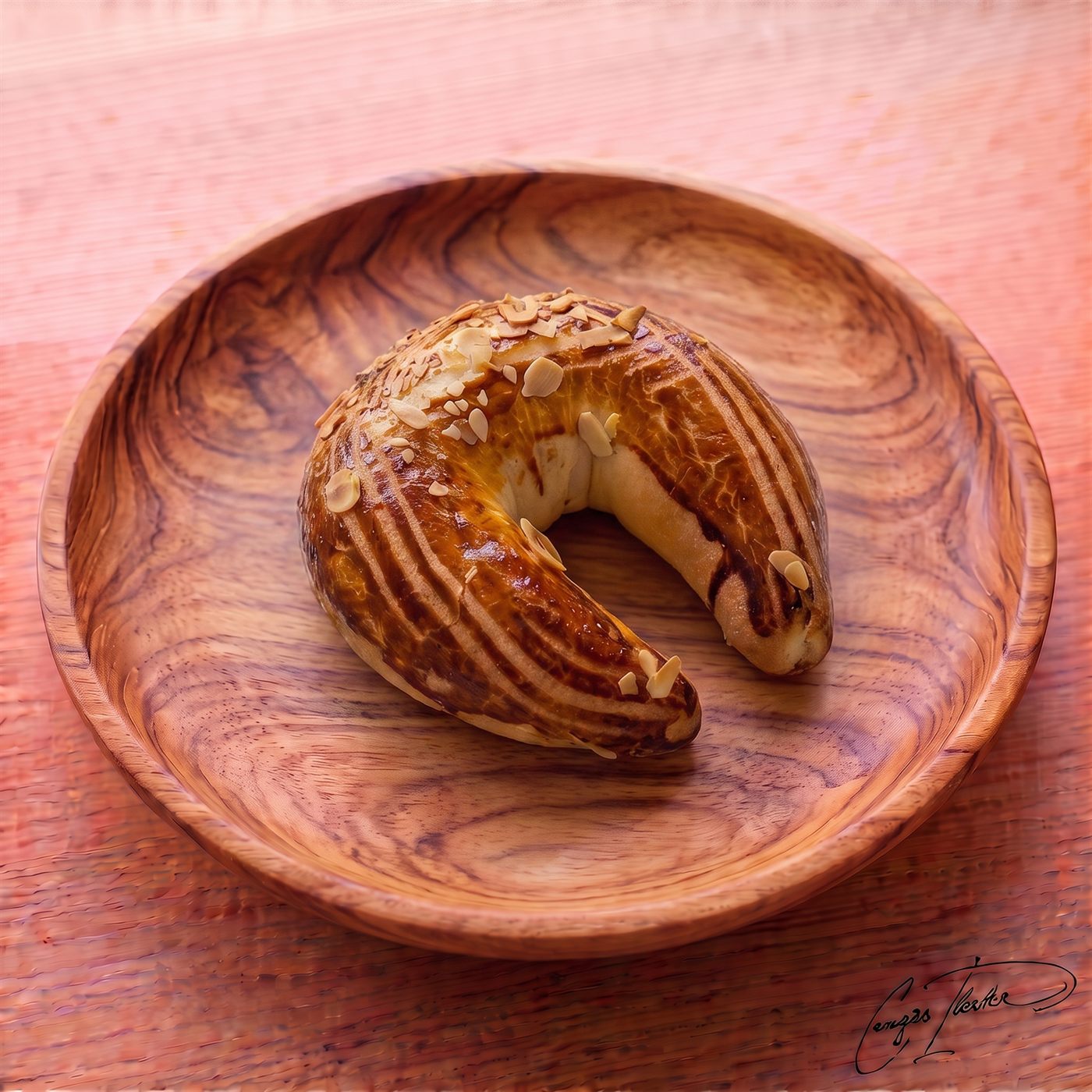 A classic crescent-shaped Turkish ay çöreği on a carved wooden plate, topped with a rich dark glaze and sliced almonds.